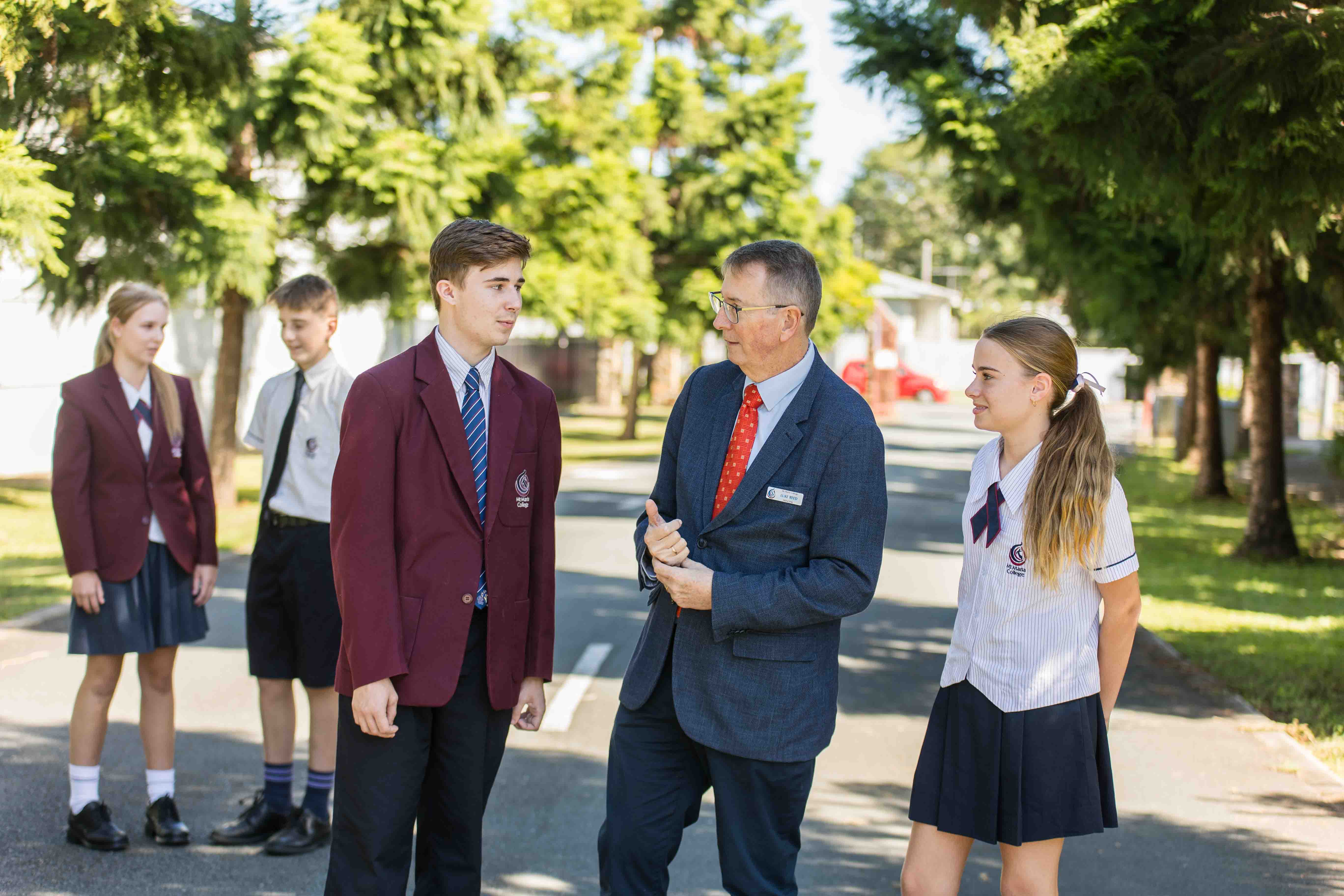 Image of Luke Reed with students.